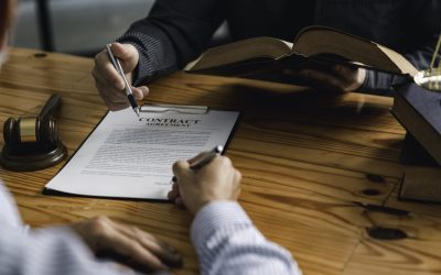 lawyer or judge is giving legal advice. to explaining about consultation terms and conditions to businessmen before signing on contract at a law firm.